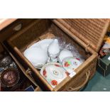 A wicker hamper containing a partial Royal Worcester dinner service etc.