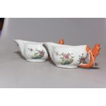 A pair of Chinese porcelain sauce boats, each with floral decoration (a/f)