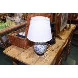 A blue and white ceramic ginger jar mounted as a table lamp