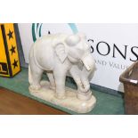 A substantial marble Indian elephant