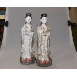A pair of Chinese stoneware Guan Yin figures, each with impressed four character mark to base.