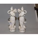 A pair of 20th century Chinese blanc de chine figures of Guan Yin, bears red stamp marks to base,