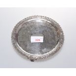 A George III silver footed dish, chased with scrolls and the rim cast with leaves, marked for