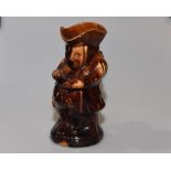 A 19th century treacle glazed toby jug