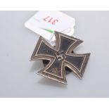 A World War II German Iron Cross 1st class, with screw back.