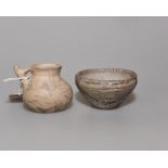 Two South American pieces of pottery, a jug and a bowl, with painted geometric decoration,