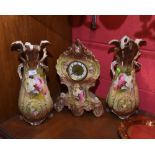 A 19th century Staffordshire clock garniture decorated with floral sprays