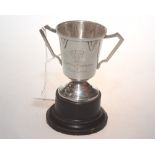 A small silver twin handled trophy, Birmingham 1932, engraved 'North Of Scotland V England' poss.