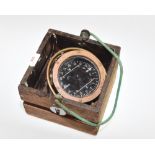 A Sestrel ship's compass in a gimbal wood casing, dial width 4"