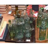 A tray of vintage glass bottles inc. apothecary, ginger beer, Newcastle Breweries and Bell Tonic,