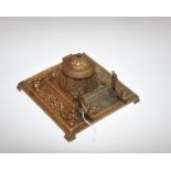 A 19th century gilt bronze inkwell cast with scrolls and acanthus leaves, 16cm by 16cm