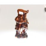 A 19th century treacle glazed toby jug