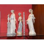 Two Lladro figures of young ladies, 35cm high and a Casades porcelain figure of a girl holding a