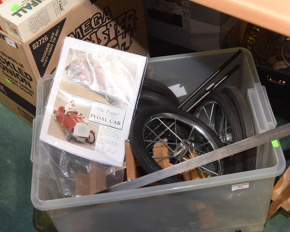 A box containing a partial child's pedal car, The Poppy"