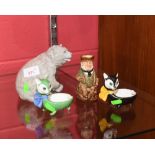 A Continenal china figure of a bear, two Grafton China novelty cat dishes and a small Royal