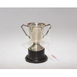 A small silver twin handled trophy, Birmingham 1932, engraved 'North Of Scotland V England' poss.