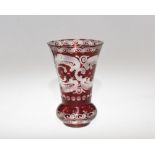 A 19th century Bohemian red flash glass vase, etched with deer and a rococo cartouche. 14cm