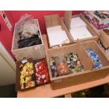 Four boxes of coloured mosaic stones and glass chips