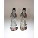 A pair of Chinese stoneware Guan Yin figures, each with impressed four character mark to base.