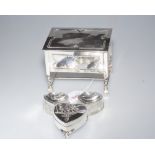 Two cut glass heart shaped pill boxes with silver lids, Birmingham 1904,  a heart shaped embossed