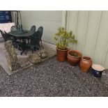 A quantity of stone and composition garden ornaments; tog. with a group of terracotta planters (9)