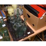 A tray of vintage glass bottles inc. apothecary, ginger beer, Newcastle Breweries and Bell Tonic,