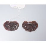 Two Chinese brown quartz carved pendants (2)