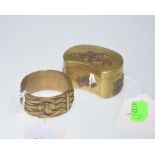 An Oriental brass napkin ring tog. with a brass snuff box of similar origin (2)