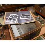 A box containing a quantity of loose postcards and photograph albums