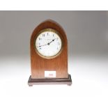 A French inlaid mahogany mantel clock, of lancet form, the white enamel dial with Arabic numerals