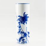 A CHINESE BLUE AND WHITE PORCELAIN BRUSH POT, painted with a bird and flowering bough, underglaze