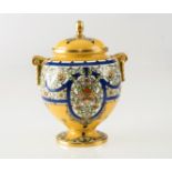 A STRIKING ROYAL WORCESTER VASE AND COVER, enamel painted with stylised flowers against a yellow