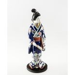 A JAPANESE MEIJI PERIOD FIGURE OF A LADY IN TRADITIONAL DRESS HOLDING A FAN, circa 1900, height 31cm