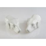 A PAIR OF 19th CENTURY WHITE-GLAZED STIRRUP CUPS, each modelled as the head of a hound. 13cm