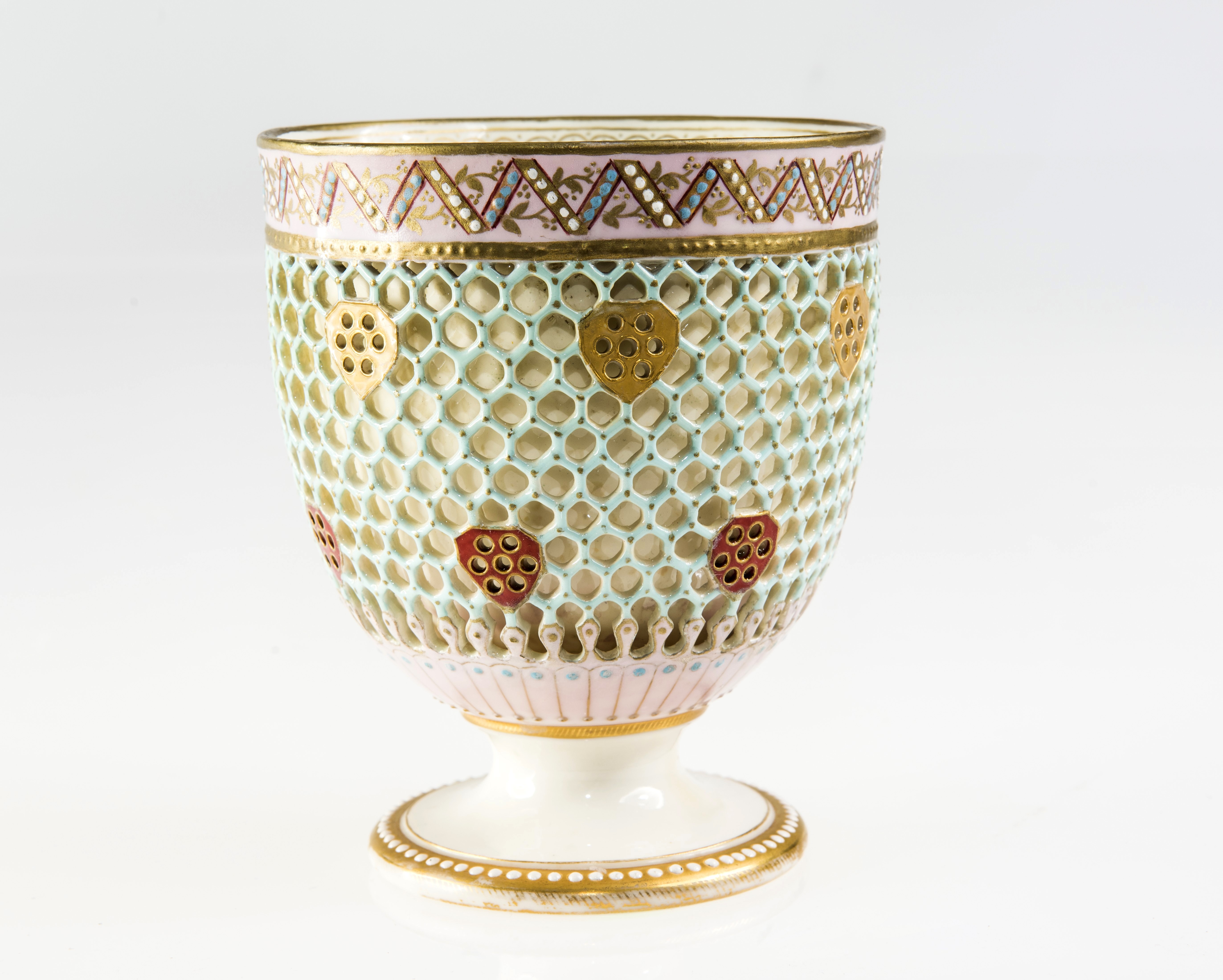 A ROYAL WORCESTER RETICULATED VASE, c.1880, designed by George Owen, of pedestal cup form, double