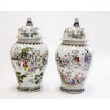 A PAIR OF LARGE CHINESE FAMILLE ROSE PORCELAIN BALUSTER JARS AND COVERS, painted with figures and