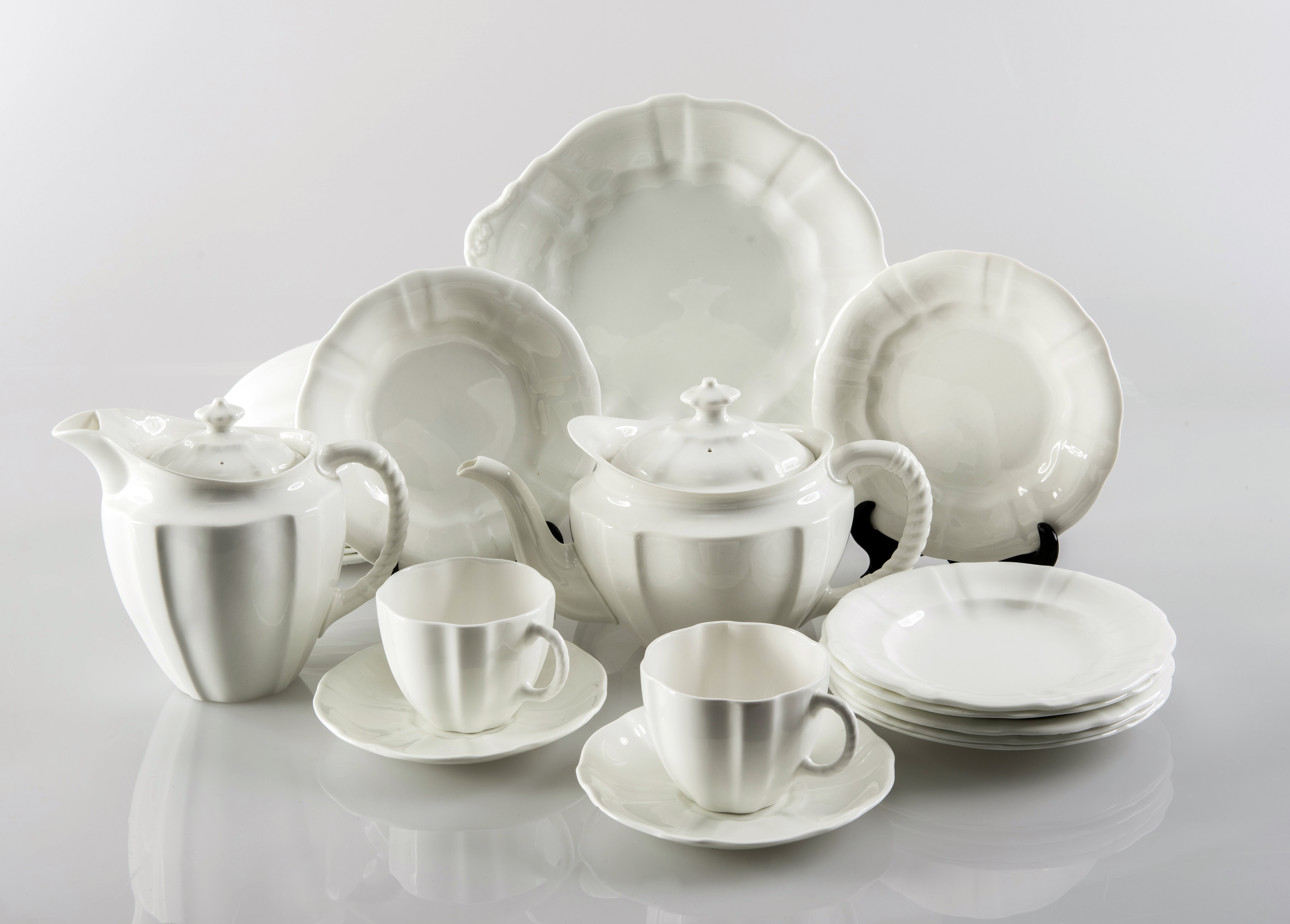 A MID-20th CENTURY ROYAL CROWN DERBY "SURREY" PATTERN TEA SERVICE, glazed in the white, comprising: