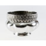 A LIBERTY & Co. PEWTER JARDINIERE, possibly by Archibald Knox, with stylised rim over a boldly