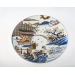 A JAPANESE PORCELAIN CHARGER, MEIJI PERIOD, possibly Fukagawa, painted with figures in a pavilion