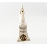 A CARLTON WARE CRESTED CHINA FIGURE OF NURSE EDITH CAVELL, modelled as her monument in London and