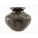 A SMALL JAPANESE BRONZE VASE, of baluster form, repousse with floral panels. 7.5cm