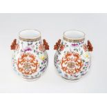 A PAIR OF CHINESE FAMILLE ROSE PORCELAIN VASES, of baluster form, applied with zoomorphic handles,