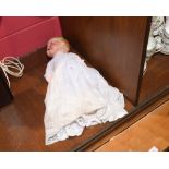 An Armand Marseille bisque headed baby doll, impressed AM Germany 351/5K, with blue eyes and open