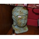 A large patinated metal buddha head