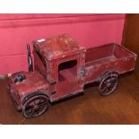 A  Vintage red painted tin toy truck