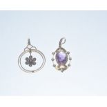 Two Edwardian amethyst and seed pearl pendants mounted in yellow metal