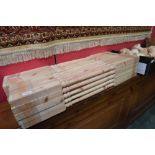 Two bundles of softwood staircase spindles