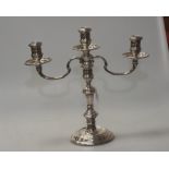 A silver three-light candelabrum, in the Georgian taste, London 1961, loaded. 30cm