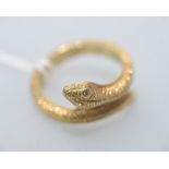 An 18ct gold snake ring, the eyes set with diamonds. 7.7 grams