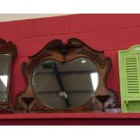 A carved mahogany overmantel mirror